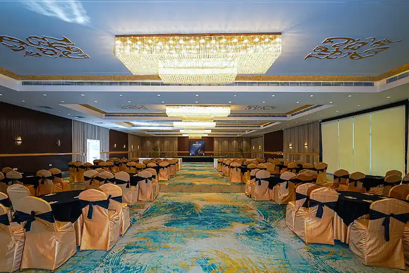 Indoor party hall with LED dance floor and DJ setup