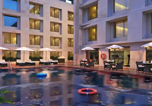 Poolside rooftop venue with city skyline views and premium bar setup