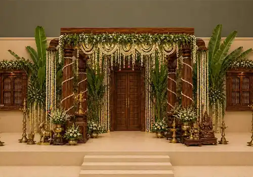 South Indian wedding decorator with traditional banana leaf decor and Kolam rangoli art